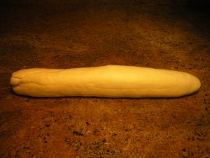 Roll out noodle dough into a log